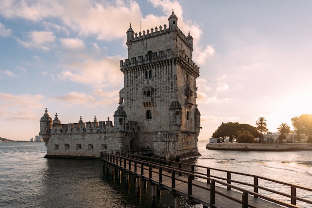 Historic Belém Tower standing guard over the Tagus River under a clear sky in Lisbon