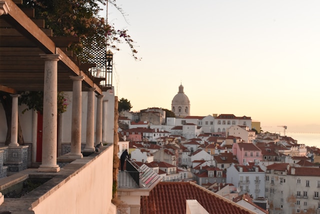 Panoramic view of Lisbon’s red rooftops during sunset